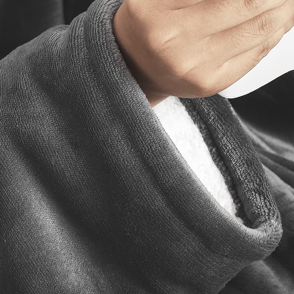 Close-up of the soft cocoon sherpa throw sleeve of COZENOVA Wearable Electric Heated Throw Blanket with Foot Pocket & Sleeves – Dark Gray.